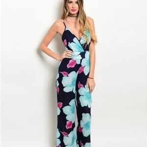 FLORAL AND BLACK JUMPSUIT W/CRISS CROSS BACK